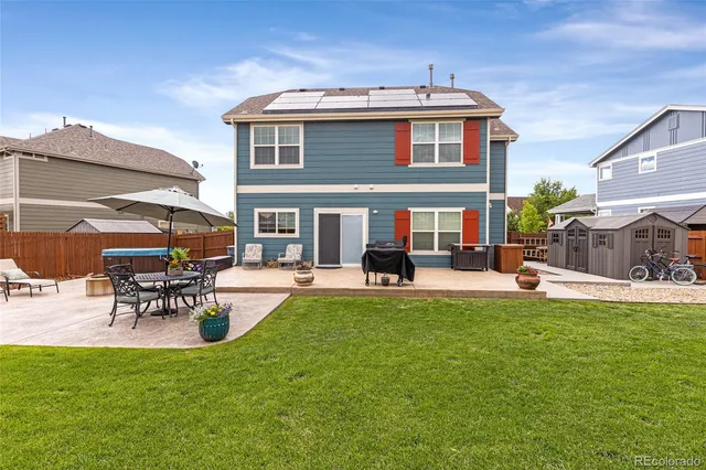 a view of a house with a back yard