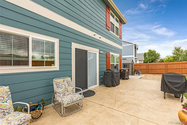 a view of two chairs in the balcony