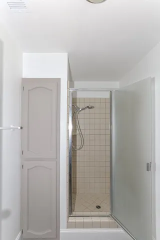 a bathroom with a granite countertop sink a toilet and a mirror