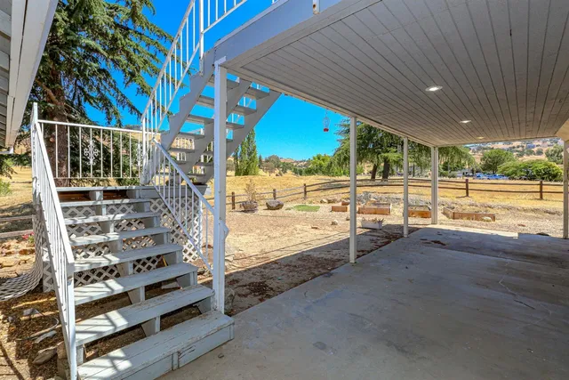 a view of a terrace with a trees