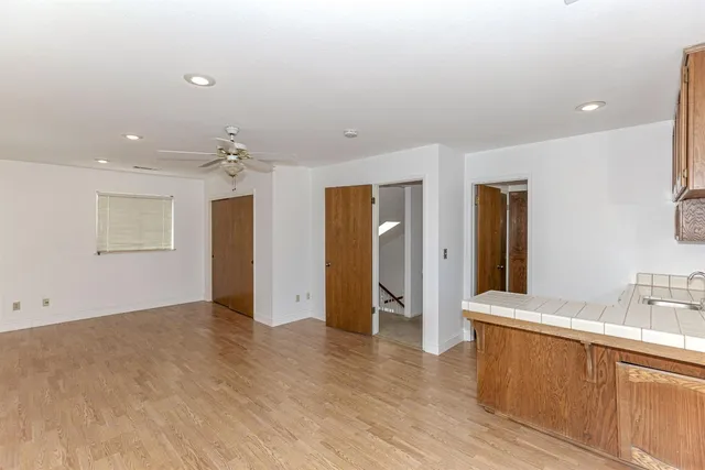 a view of storage and utility room with wooden floor