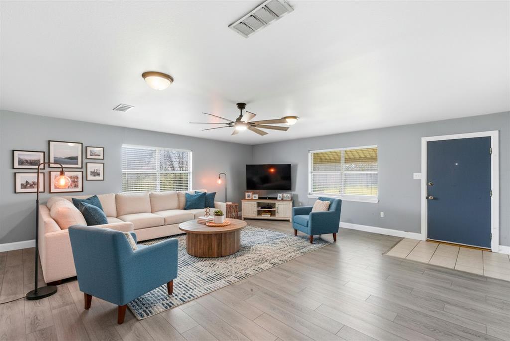 504 North Hall Street Hamilton, TX 76531 - Photo 13 of 31 a living room with furniture and a flat screen tv