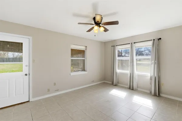 a view of an empty room with a window