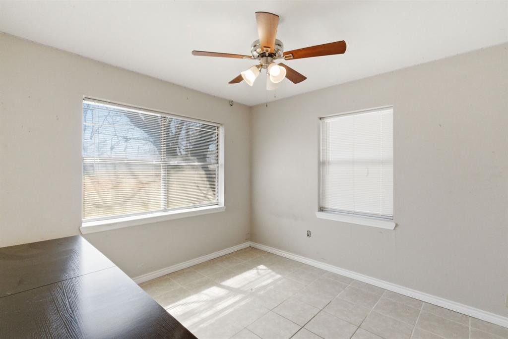 504 North Hall Street Hamilton, TX 76531 - Photo 21 of 31 an empty room with windows and fan