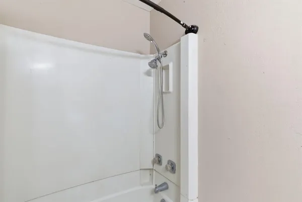 a bathroom with a shower and a shower