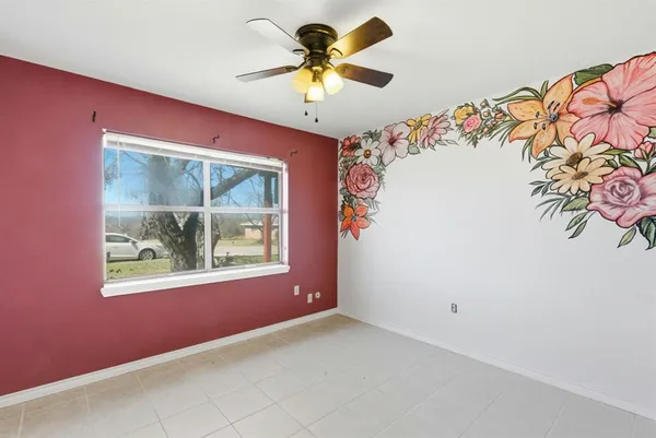 a view of an empty room with a window