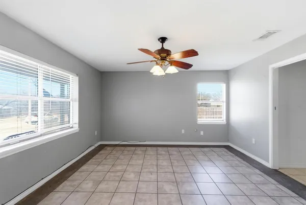 a view of an empty room with a window