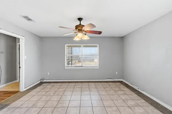 a view of an empty room and window