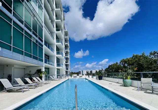 a view of a yard with an outdoor seating