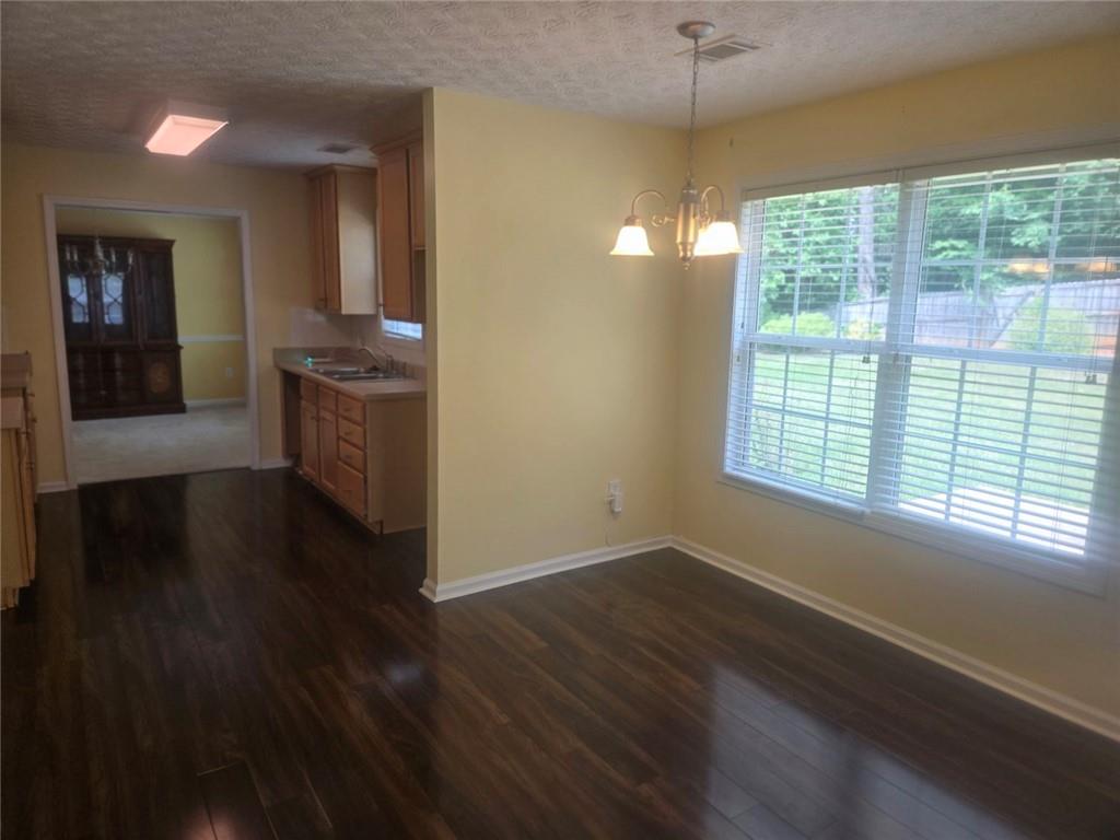 22 Windcrest Keep Covington, GA 30016 - Photo 12 of 32 a view of an empty room with window and wooden floor