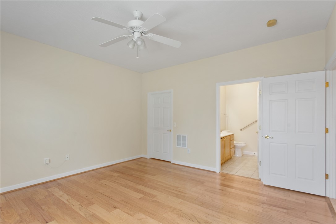 155 Life Style Lane Anderson, SC 29621 - Photo 19 of 49 This airy bedroom features gleaming hardwood floors and convenient access to an adjacent bathroom.