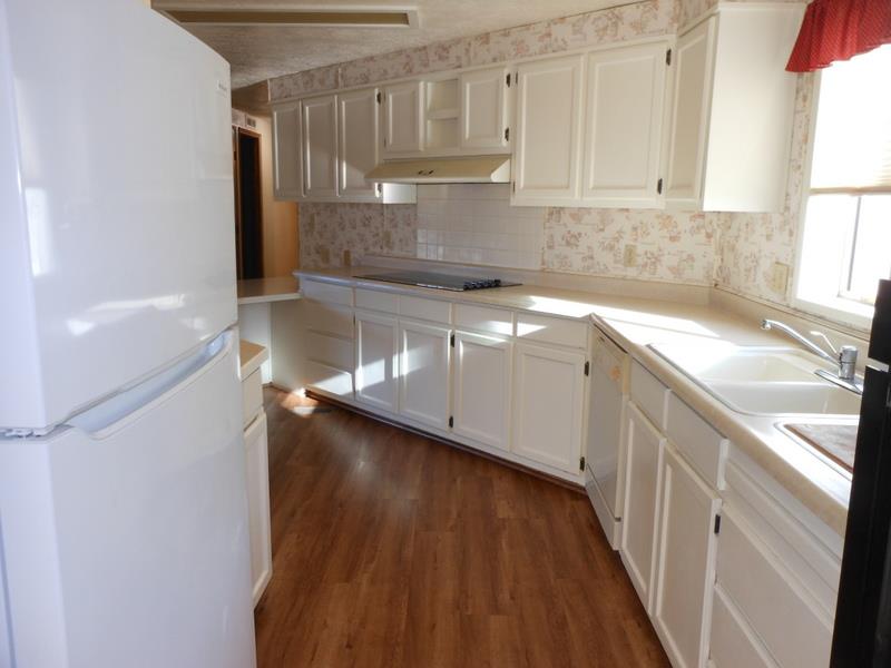 10073 Dalewood Way Grass Valley, CA 95949 - Photo 6 of 34 a kitchen with a sink a stove and cabinets