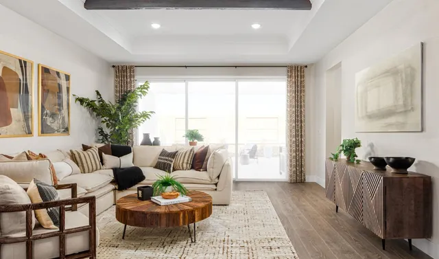 a view of a hallway with bathroom and wooden floor