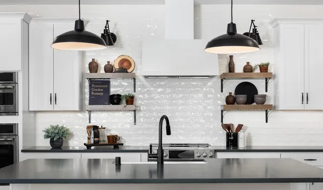 a kitchen with a stove and a white cabinets