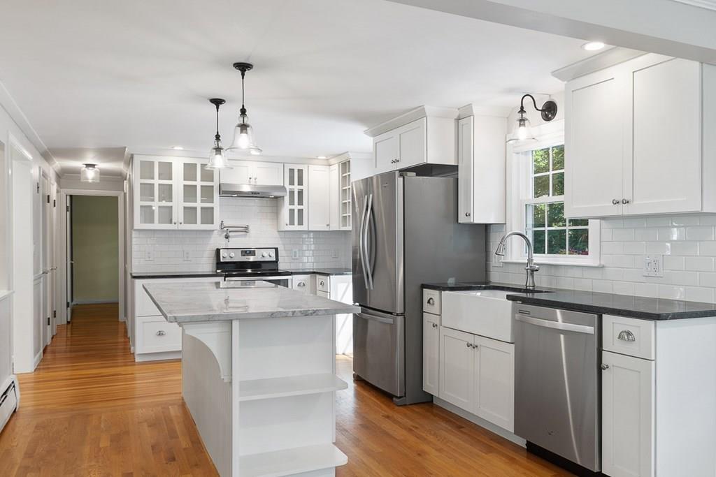 130 Monsen Road Concord, MA 01742 - Photo 10 of 26 a kitchen with kitchen island a sink stove and refrigerator