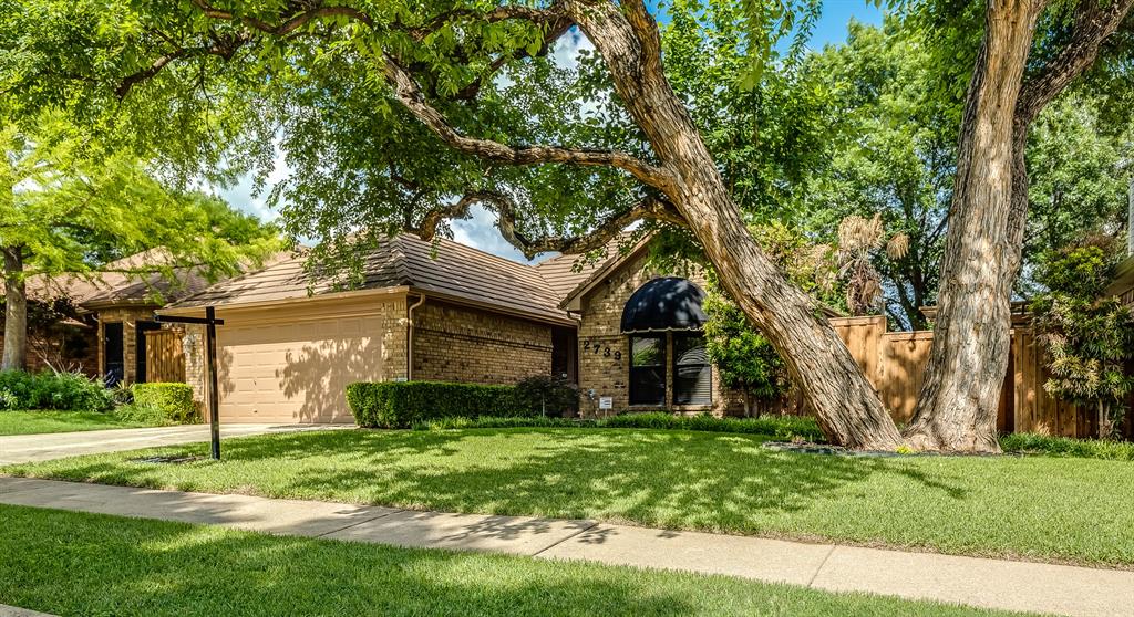 2739 Sedgeway Lane Carrollton, TX 75006 - Photo 1 of 1 front view of a house with a tree in a yard
