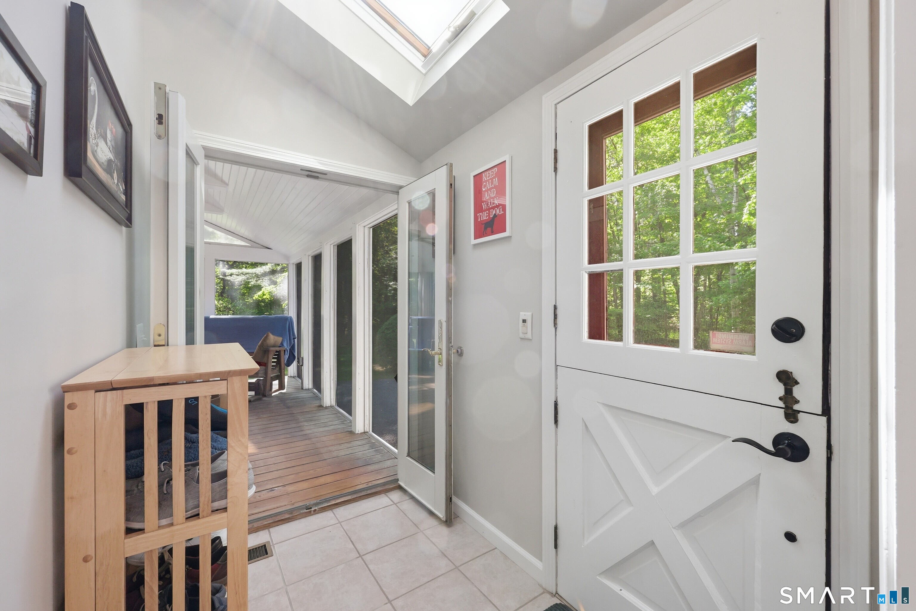 174 Canton Road Granby, CT 06035 - Photo 4 of 35 a view of a hallway with wooden floor and windows