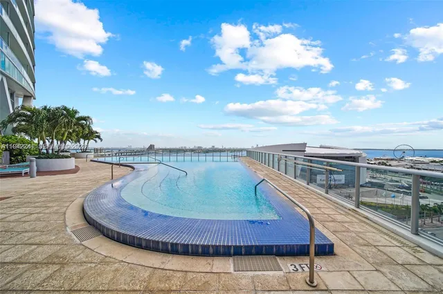 a view of swimming pool with a lounge chair
