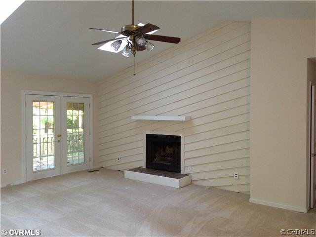 2906 Cove Ridge Trace Midlothian, VA 23112 - Photo 3 of 10 a view of an empty room with a fireplace