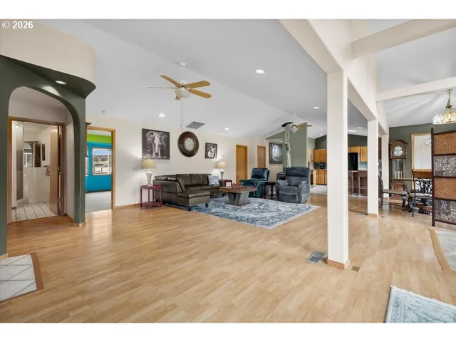 a kitchen with a stove a refrigerator and cabinets