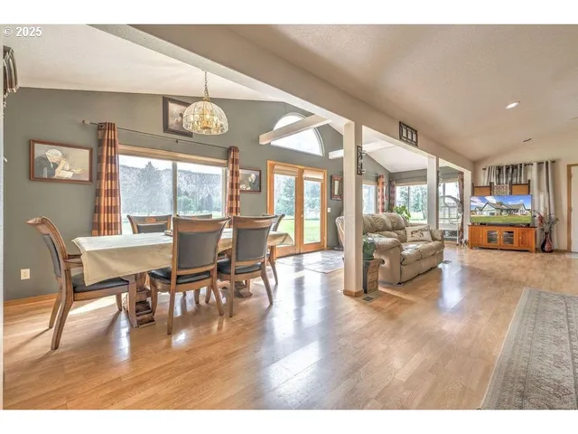 a view of a dining area with furniture window and wooden floor