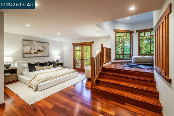 a bed room with a bed and a large window