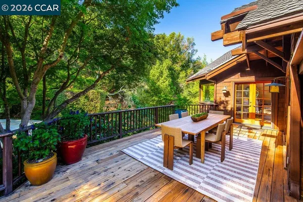 a view of a patio with table and chairs