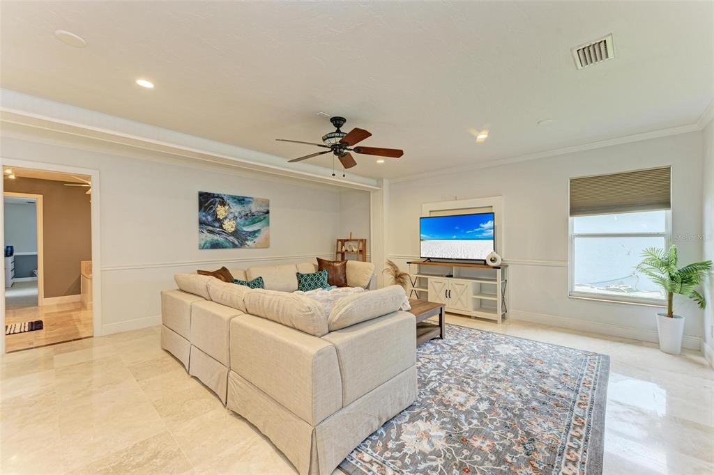 6715 12th Avenue Northwest Bradenton, FL 34209 - Photo 17 of 43 a living room with furniture and a flat screen tv