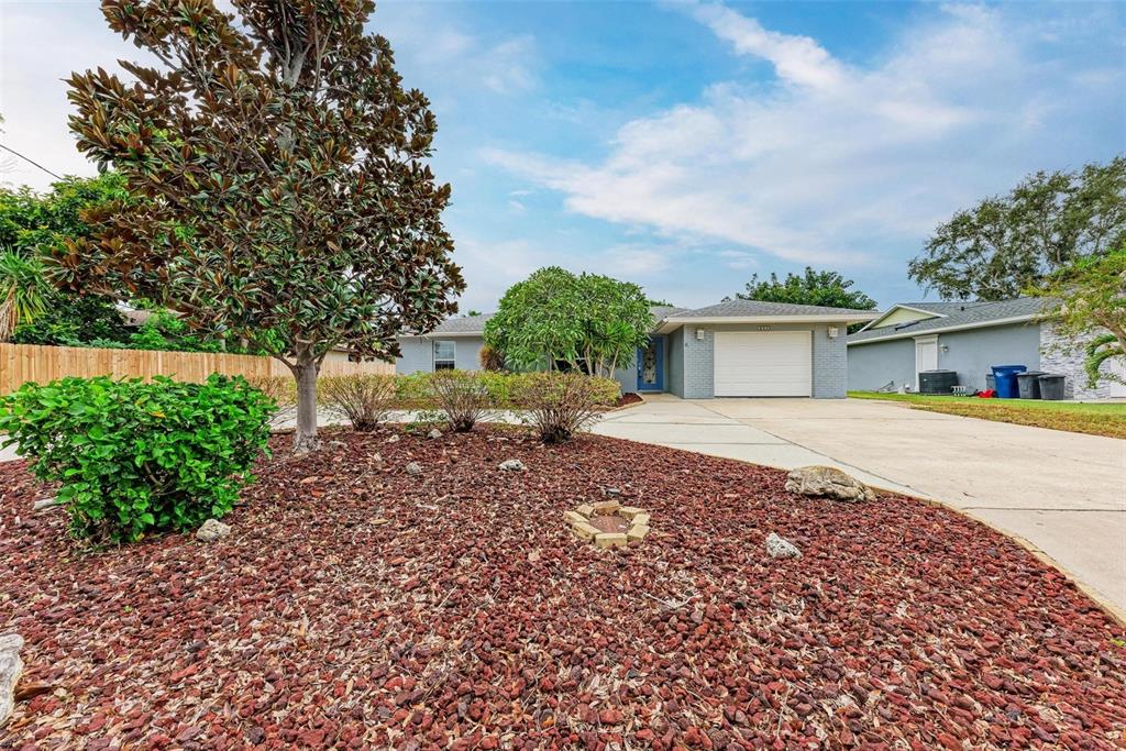 6715 12th Avenue Northwest Bradenton, FL 34209 - Photo 2 of 43 a front view of a house with garden