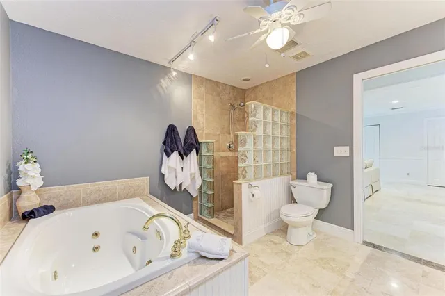 a bathroom with a bathtub sink and toilet