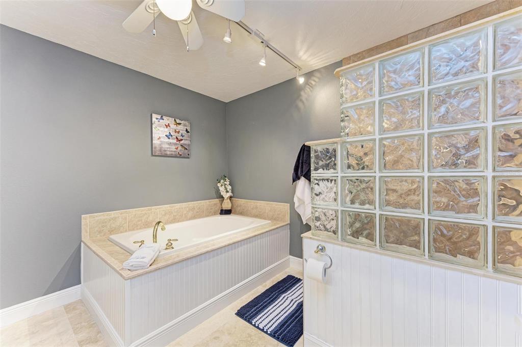 6715 12th Avenue Northwest Bradenton, FL 34209 - Photo 26 of 43 a view of en suite bathroom with a sink and a large mirror