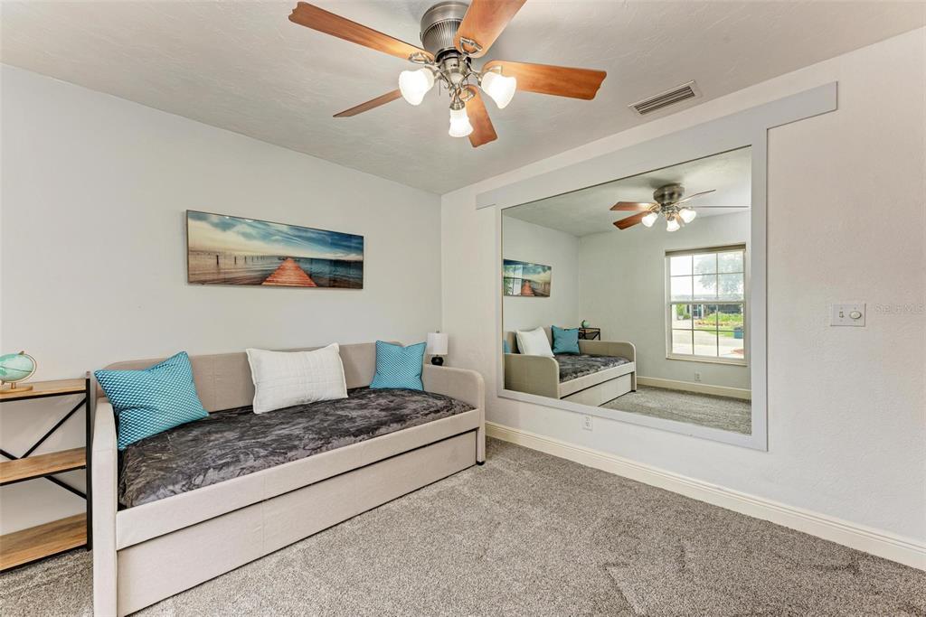 6715 12th Avenue Northwest Bradenton, FL 34209 - Photo 33 of 43 a living room with furniture and a chandelier