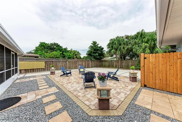 swimming pool view with sitting space and garden view