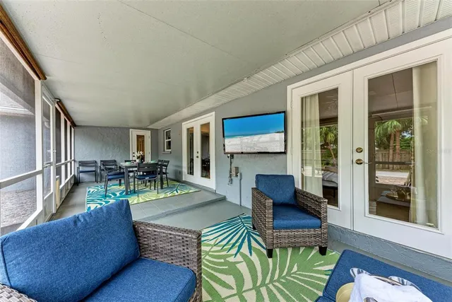 a living room with furniture fireplace and a table