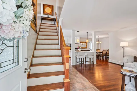 a view of dining room with furniture and wooden floor