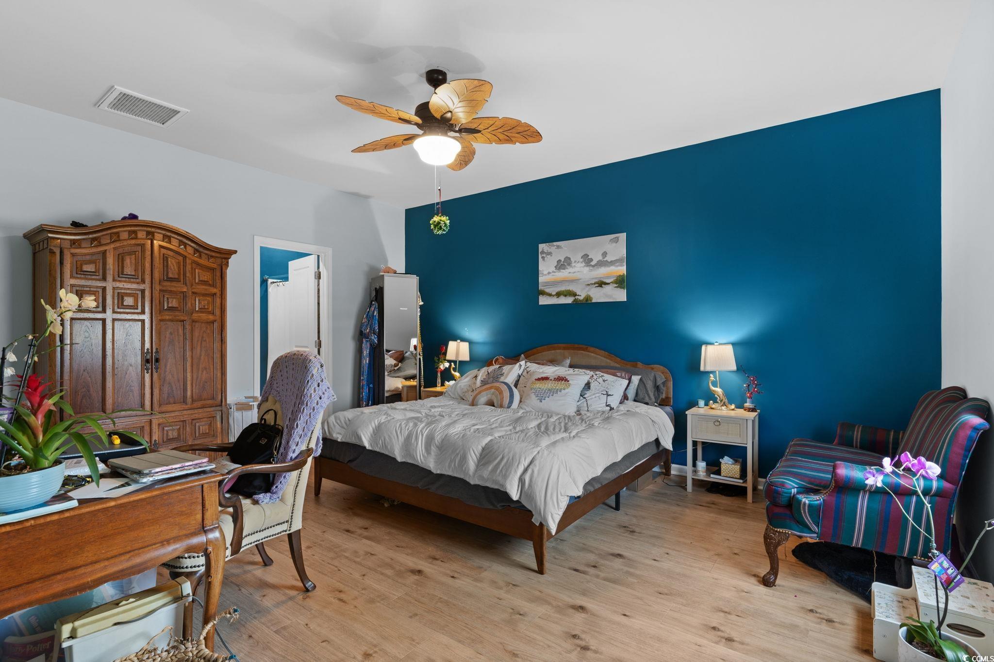 196 Cypress Tree Loop Longs, SC 29568 - Photo 13 of 40 Bedroom featuring wood finished floors and ceiling fan