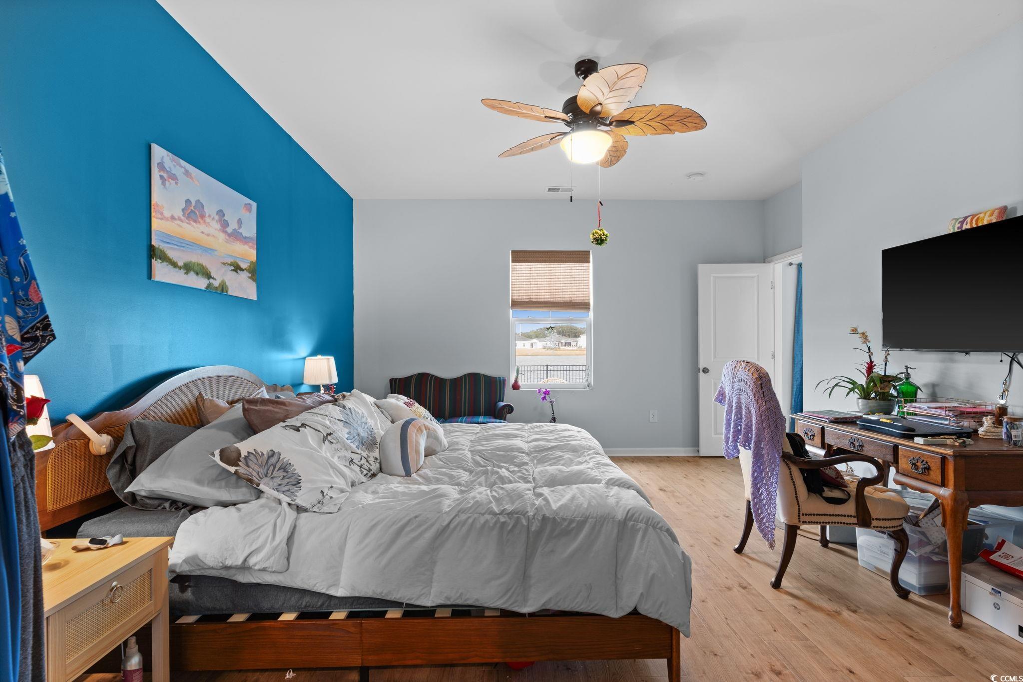 196 Cypress Tree Loop Longs, SC 29568 - Photo 14 of 40 Bedroom with light wood-type flooring and ceiling fan