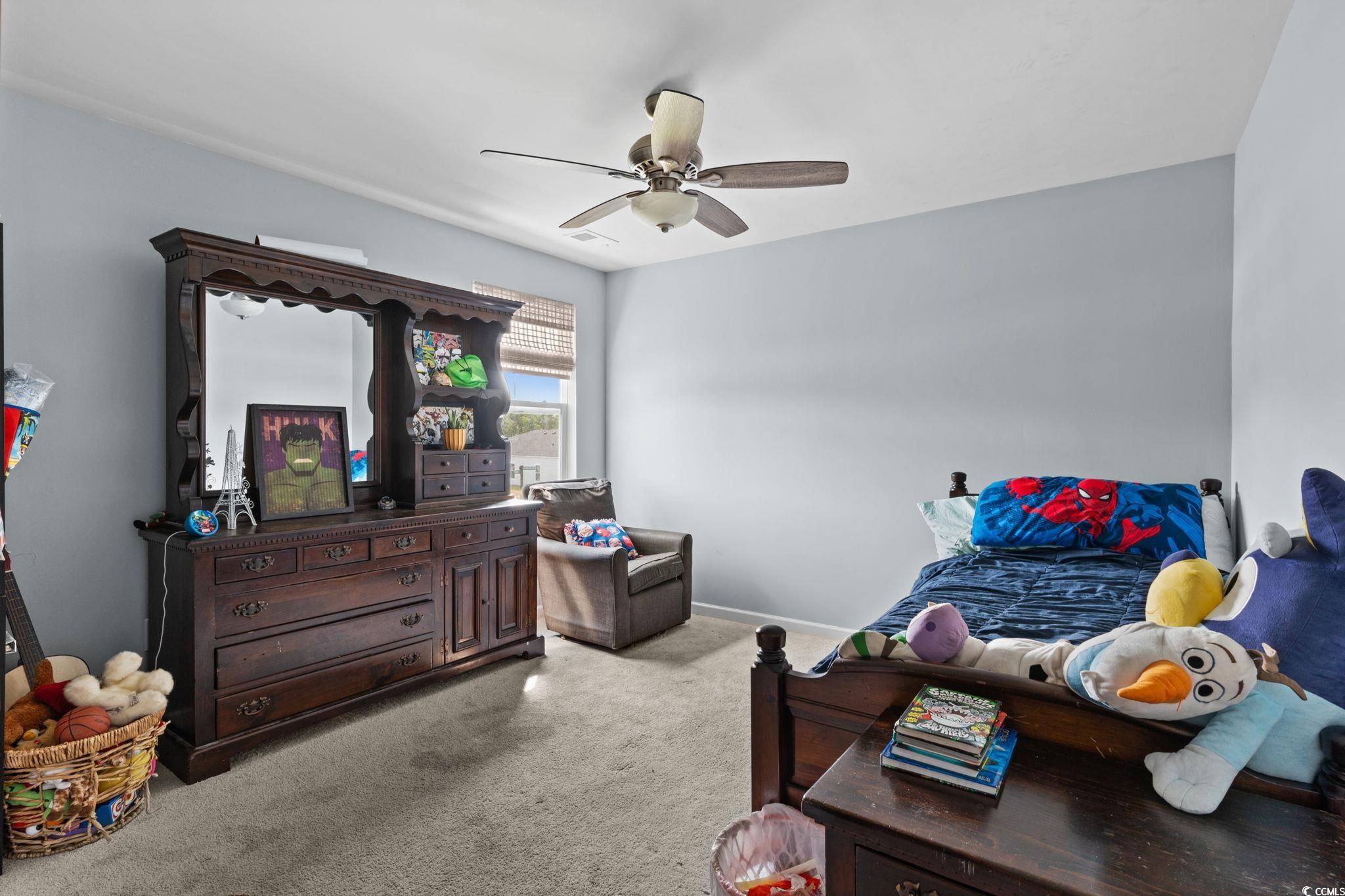 196 Cypress Tree Loop Longs, SC 29568 - Photo 23 of 40 Bedroom with carpet flooring, ceiling fan, and baseboards