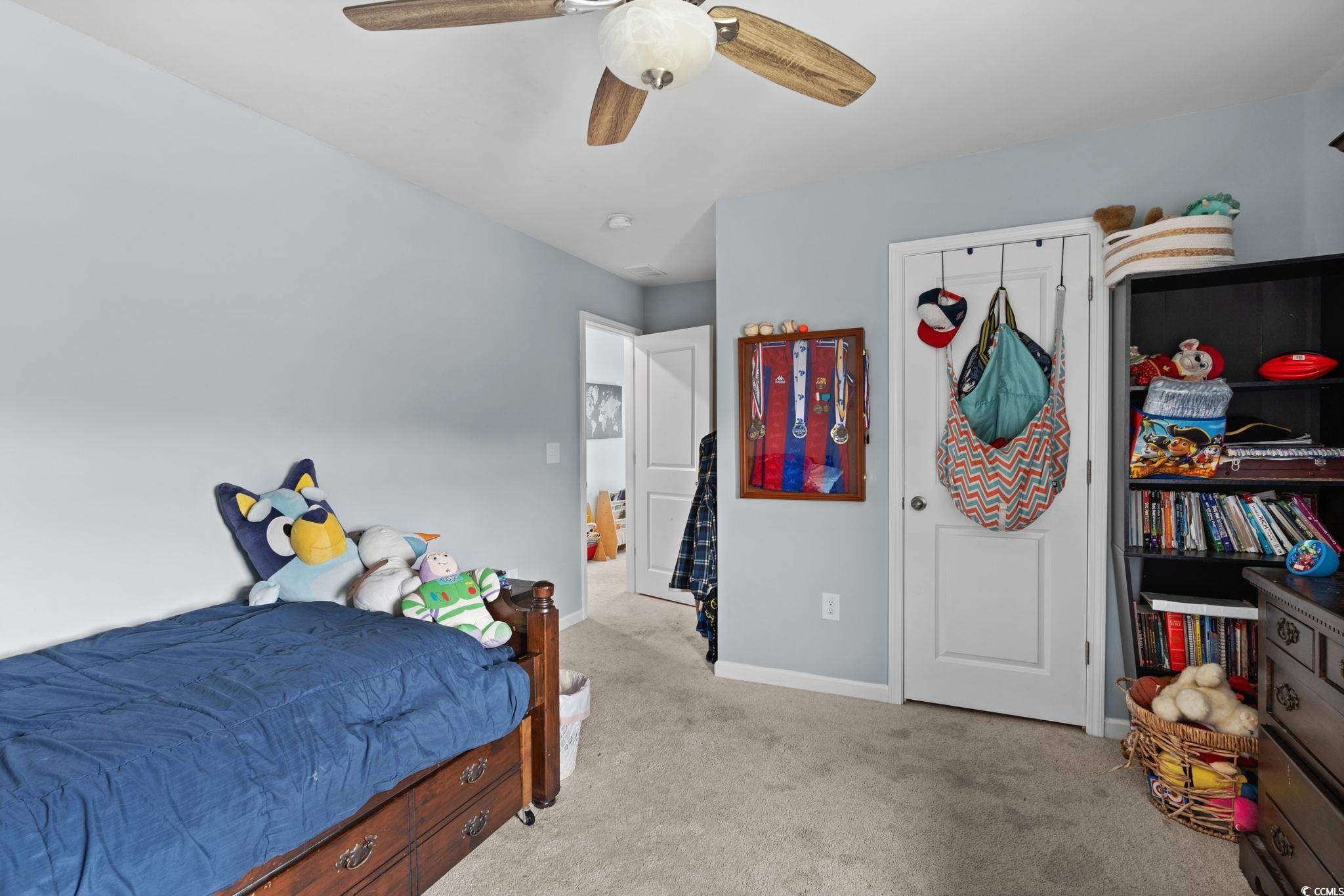 196 Cypress Tree Loop Longs, SC 29568 - Photo 24 of 40 Bedroom with carpet floors, baseboards, and ceiling fan