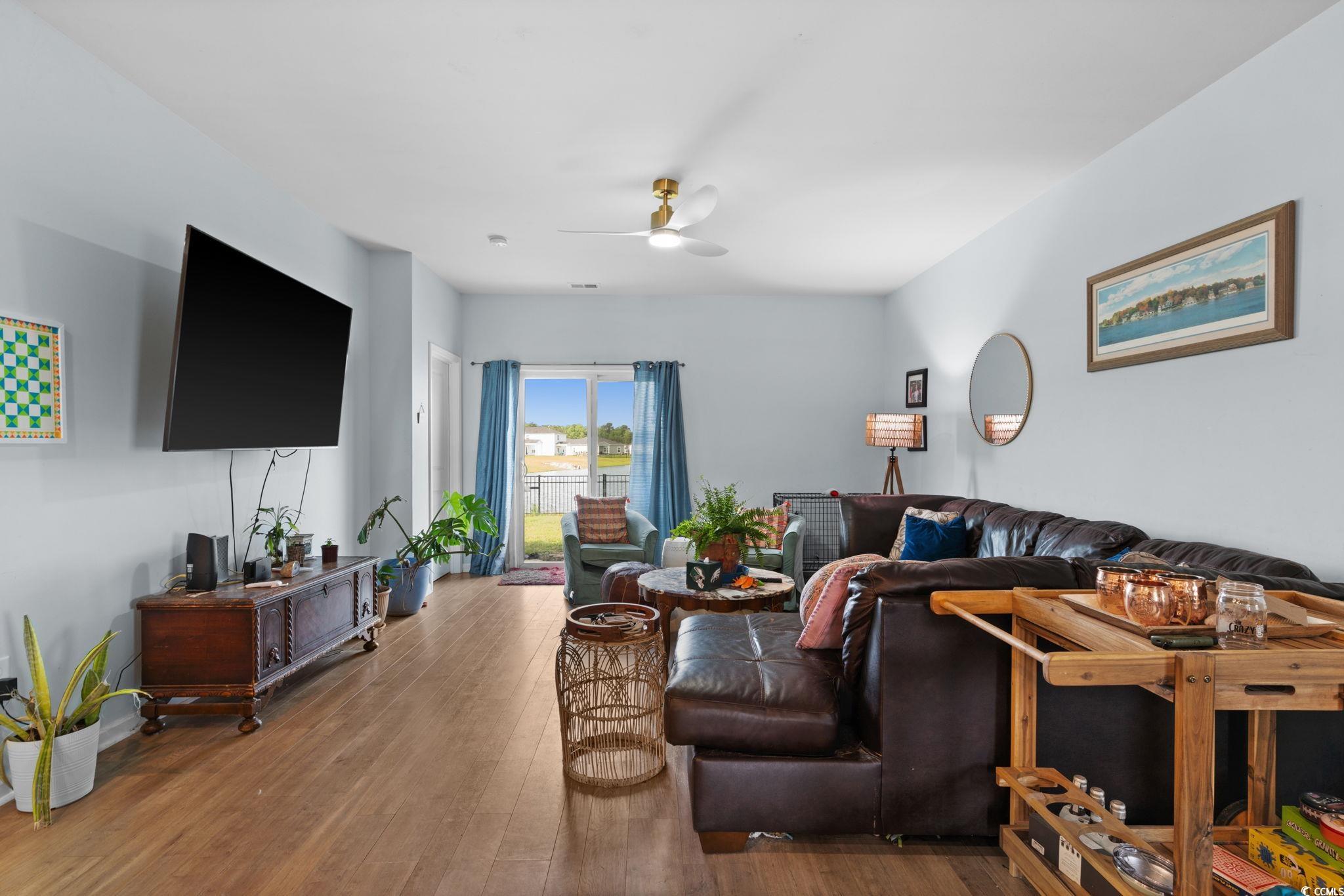 196 Cypress Tree Loop Longs, SC 29568 - Photo 3 of 40 Living room with ceiling fan and hardwood / wood-style floors