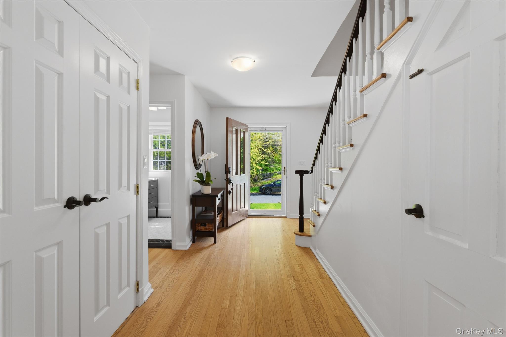 136 Devonshire Road Larchmont, NY 10538 - Photo 14 of 34 a view of a hallway with wooden floor and staircase
