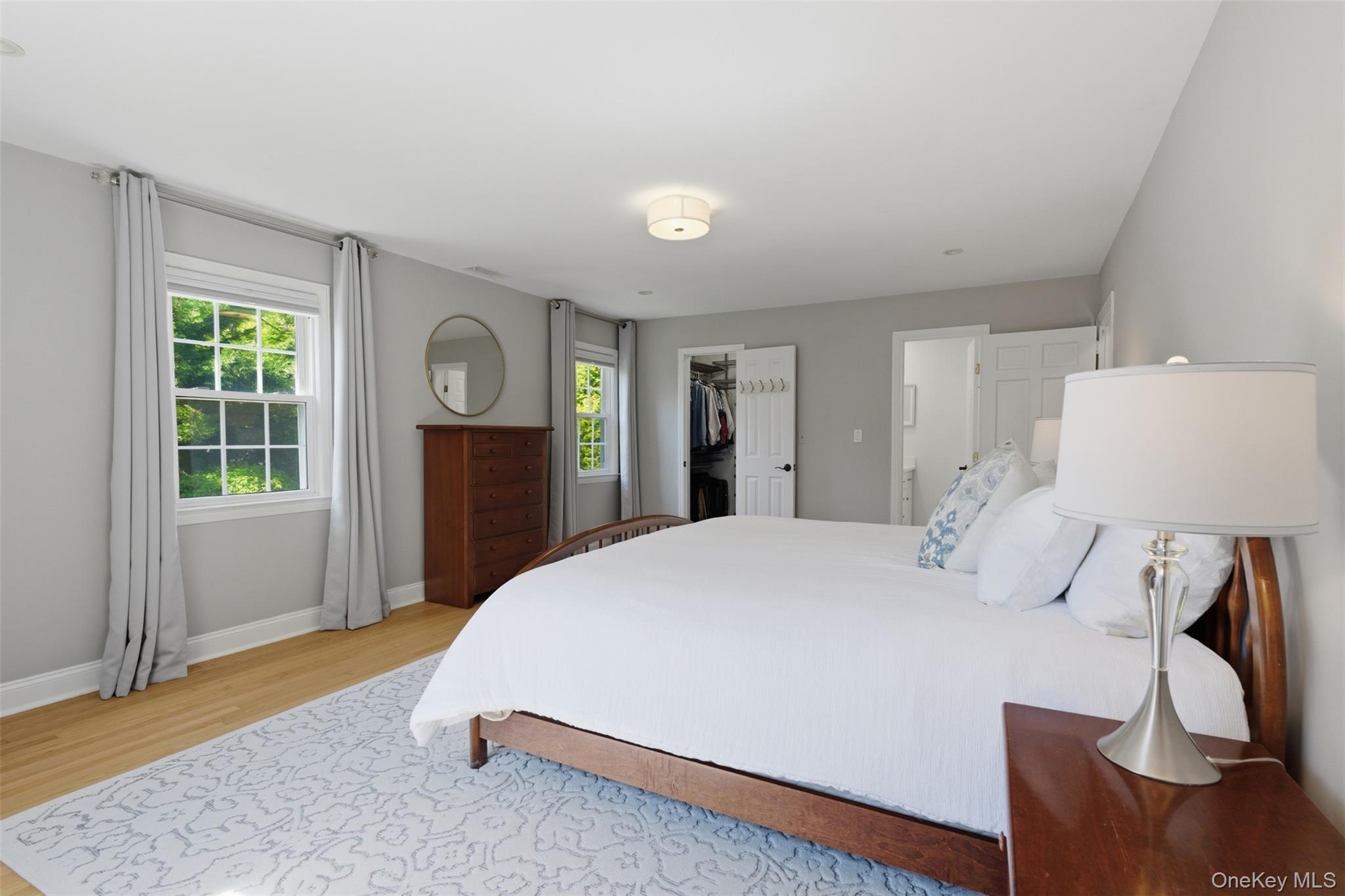 136 Devonshire Road Larchmont, NY 10538 - Photo 16 of 34 a bedroom with a bed and a window
