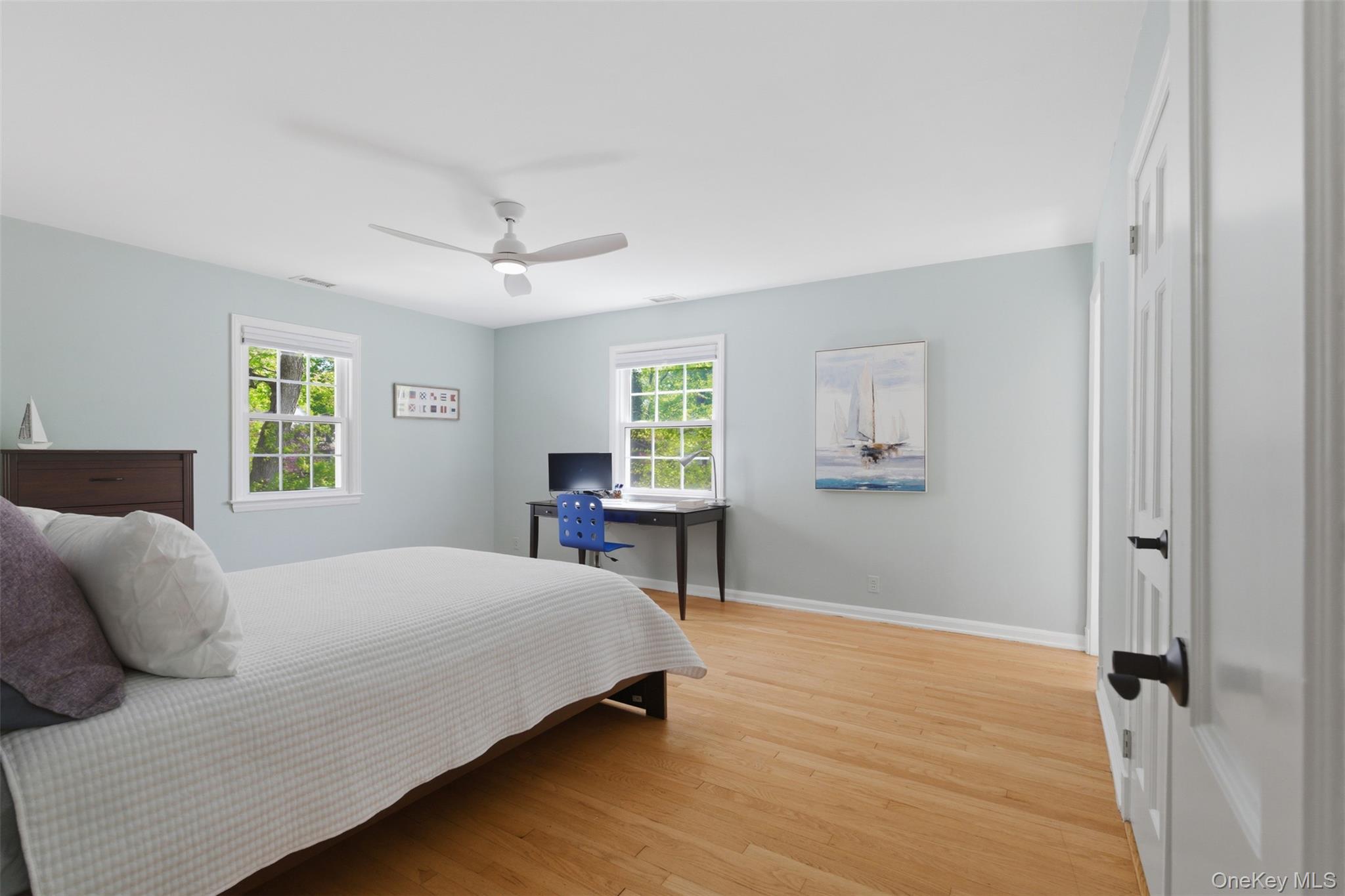 136 Devonshire Road Larchmont, NY 10538 - Photo 19 of 34 a bedroom with a bed and a window
