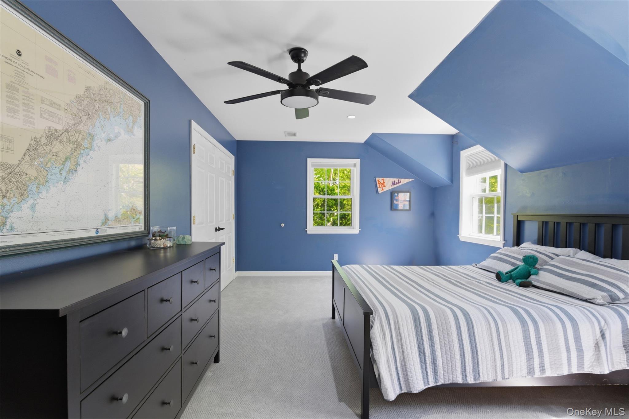 136 Devonshire Road Larchmont, NY 10538 - Photo 23 of 34 a bedroom with a bed and a window