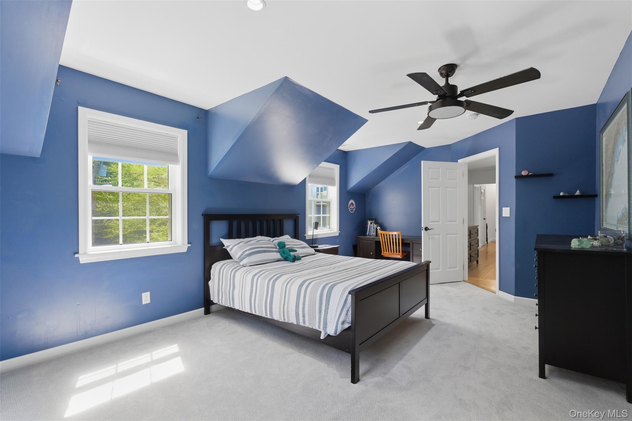 136 Devonshire Road Larchmont, NY 10538 - Photo 24 of 34 a bedroom with a bed ceiling fan and a window
