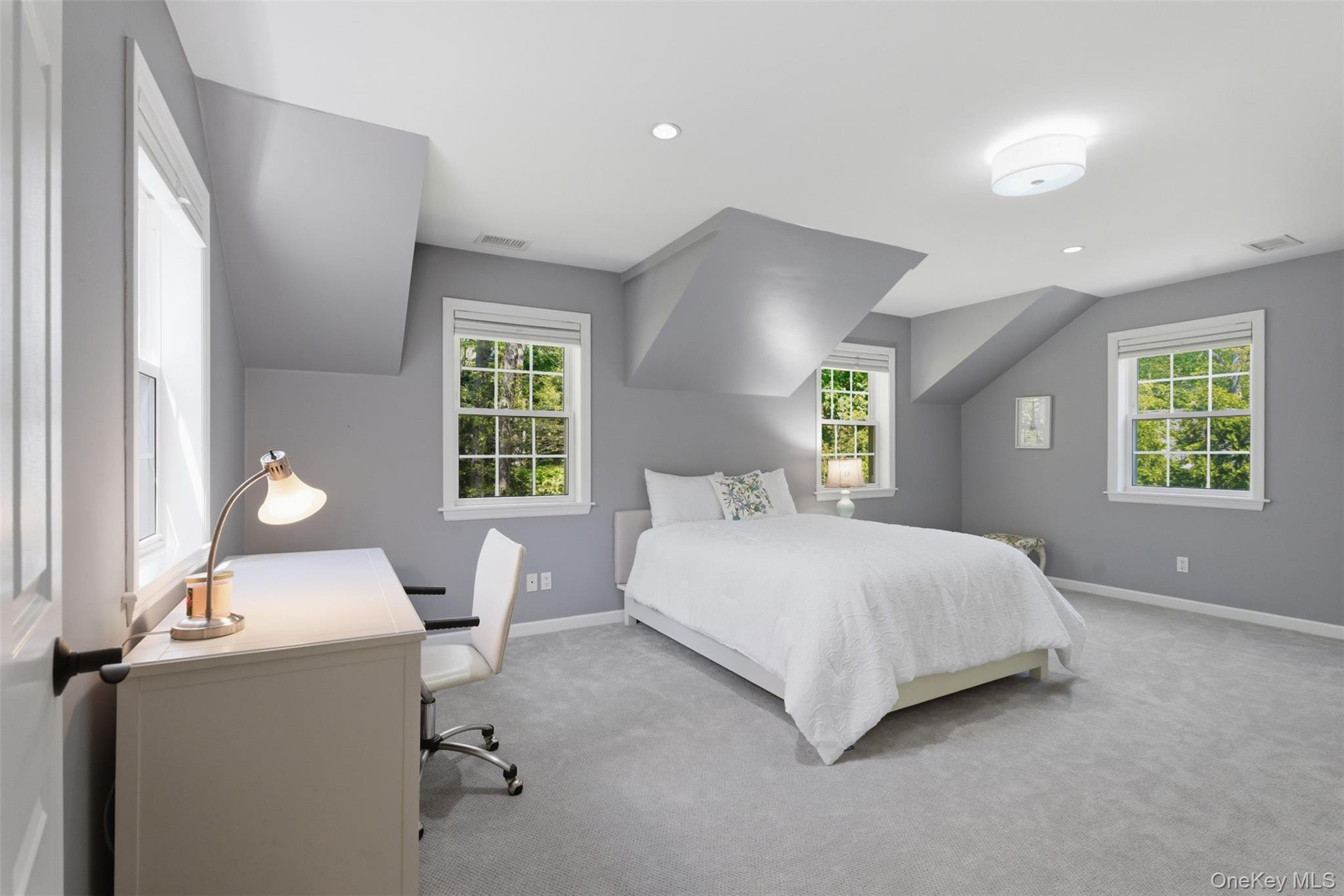 136 Devonshire Road Larchmont, NY 10538 - Photo 25 of 34 a bedroom with a bed and window