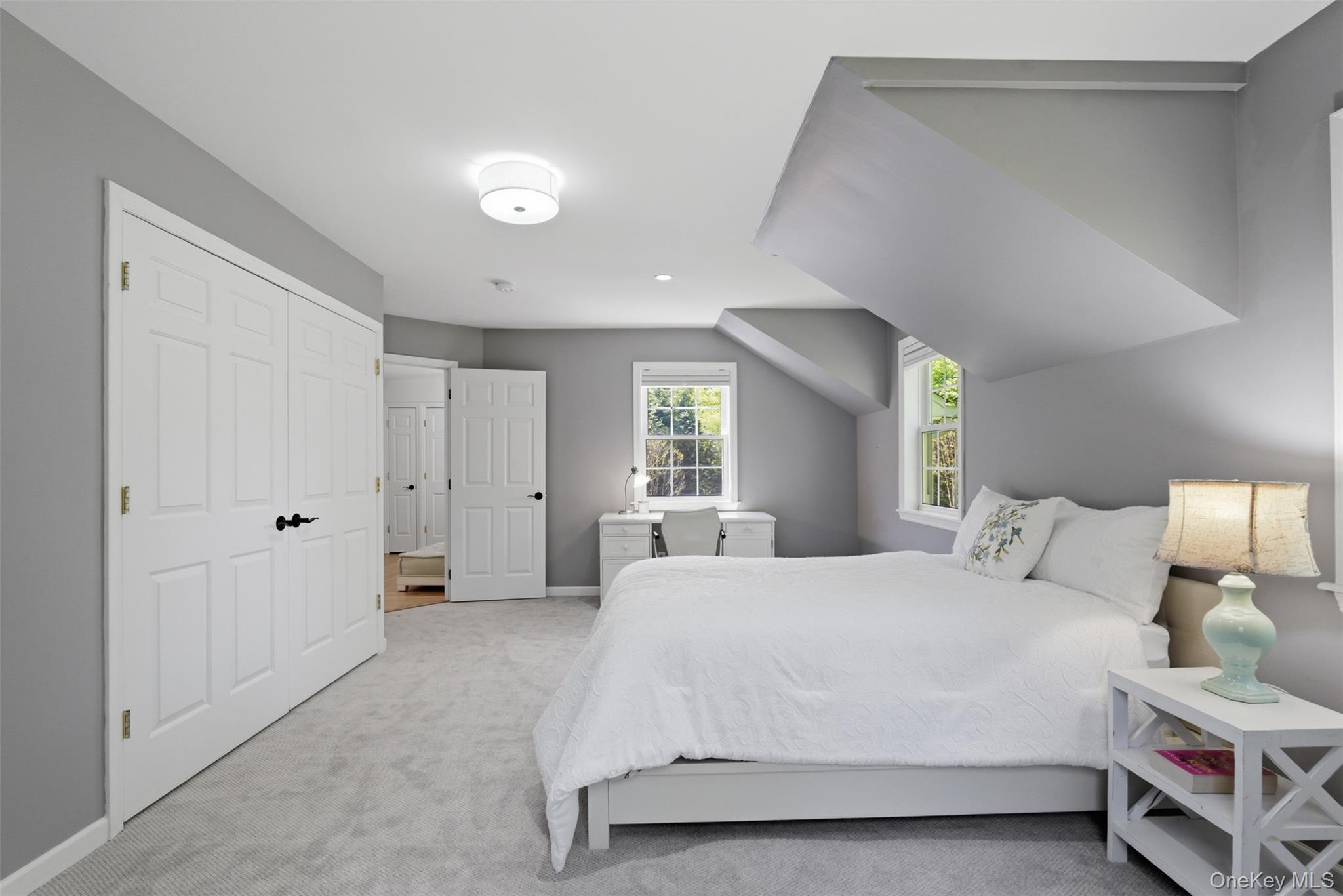 136 Devonshire Road Larchmont, NY 10538 - Photo 26 of 34 a bedroom with a bed and a window