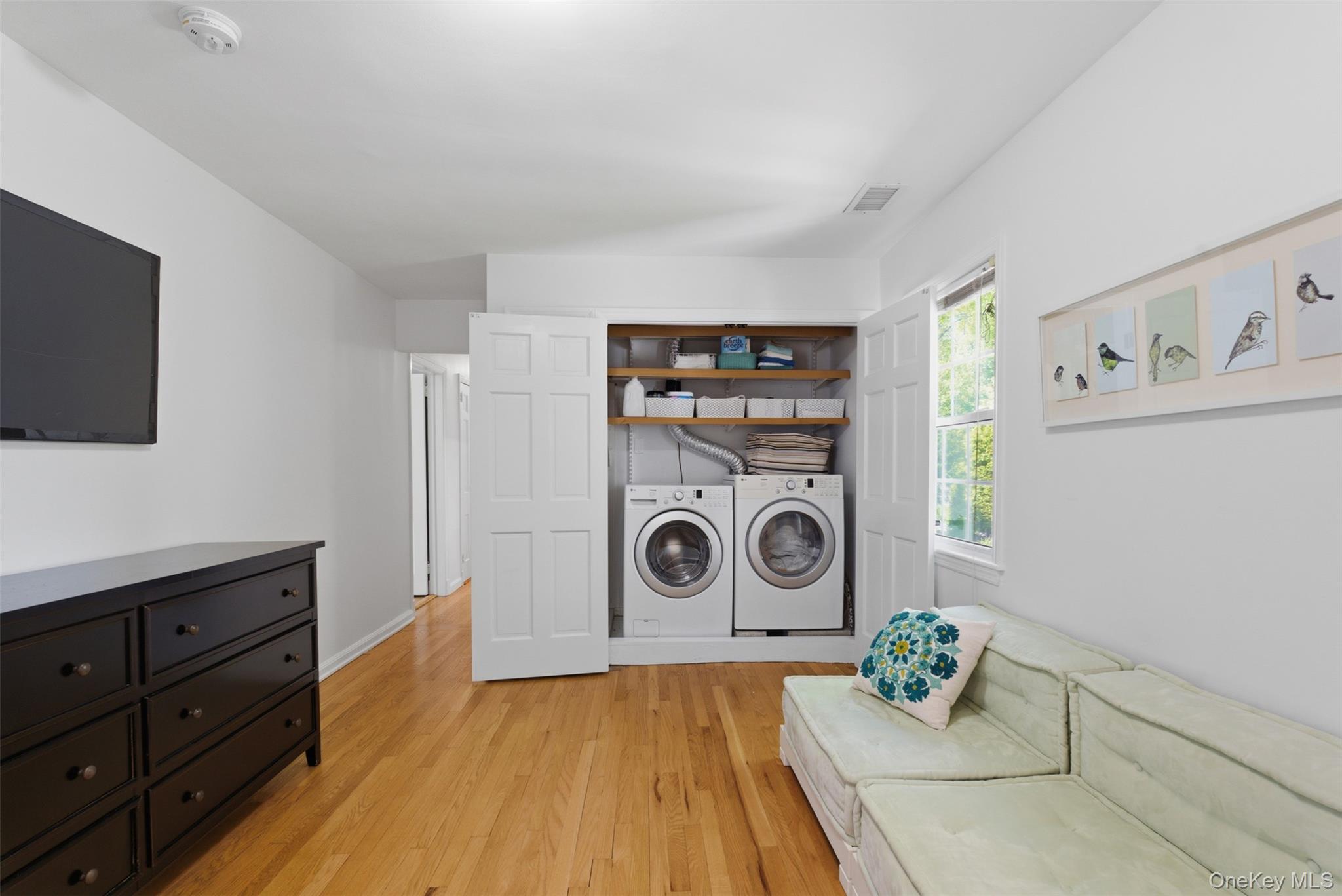 136 Devonshire Road Larchmont, NY 10538 - Photo 27 of 34 a view of a storage and utility room with washer and dryer