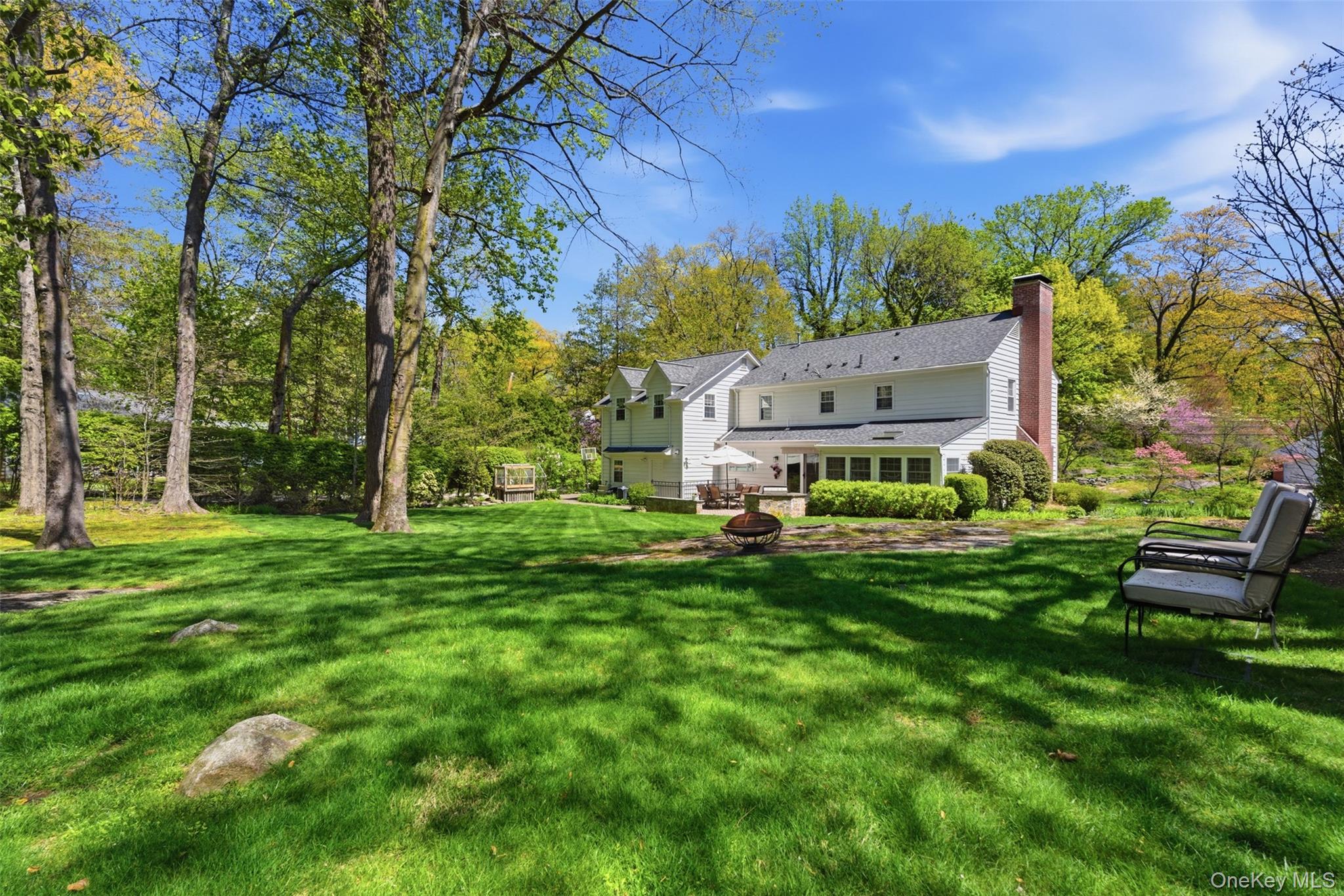 136 Devonshire Road Larchmont, NY 10538 - Photo 30 of 34 a view of a house with a big yard