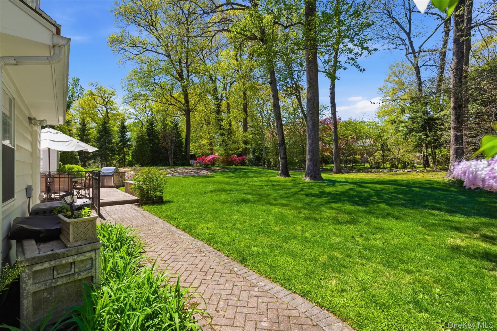 136 Devonshire Road Larchmont, NY 10538 - Photo 32 of 34 a view of a backyard with garden